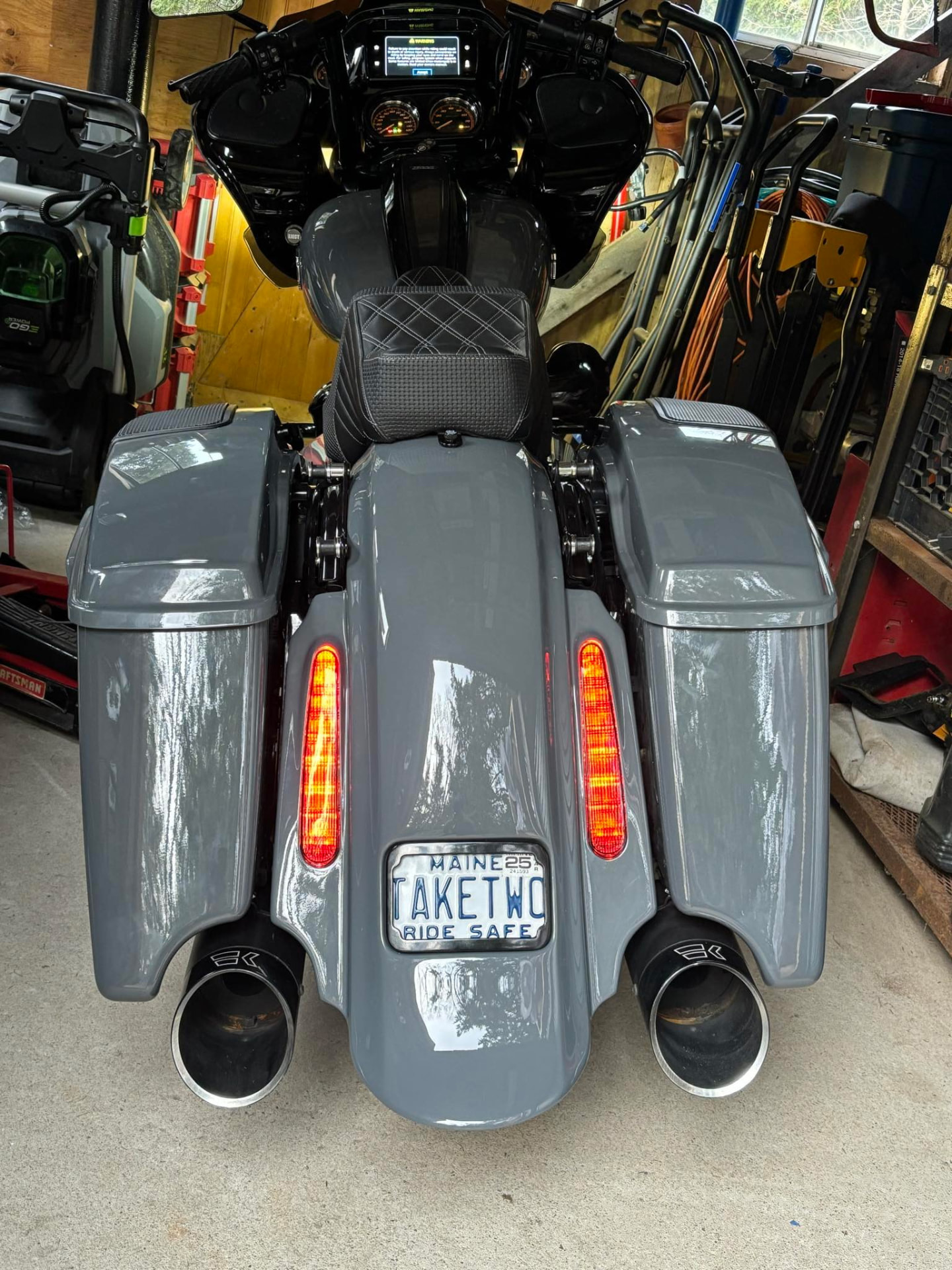 Rear view of a custom gray-painted touring motorcycle with matching saddlebags